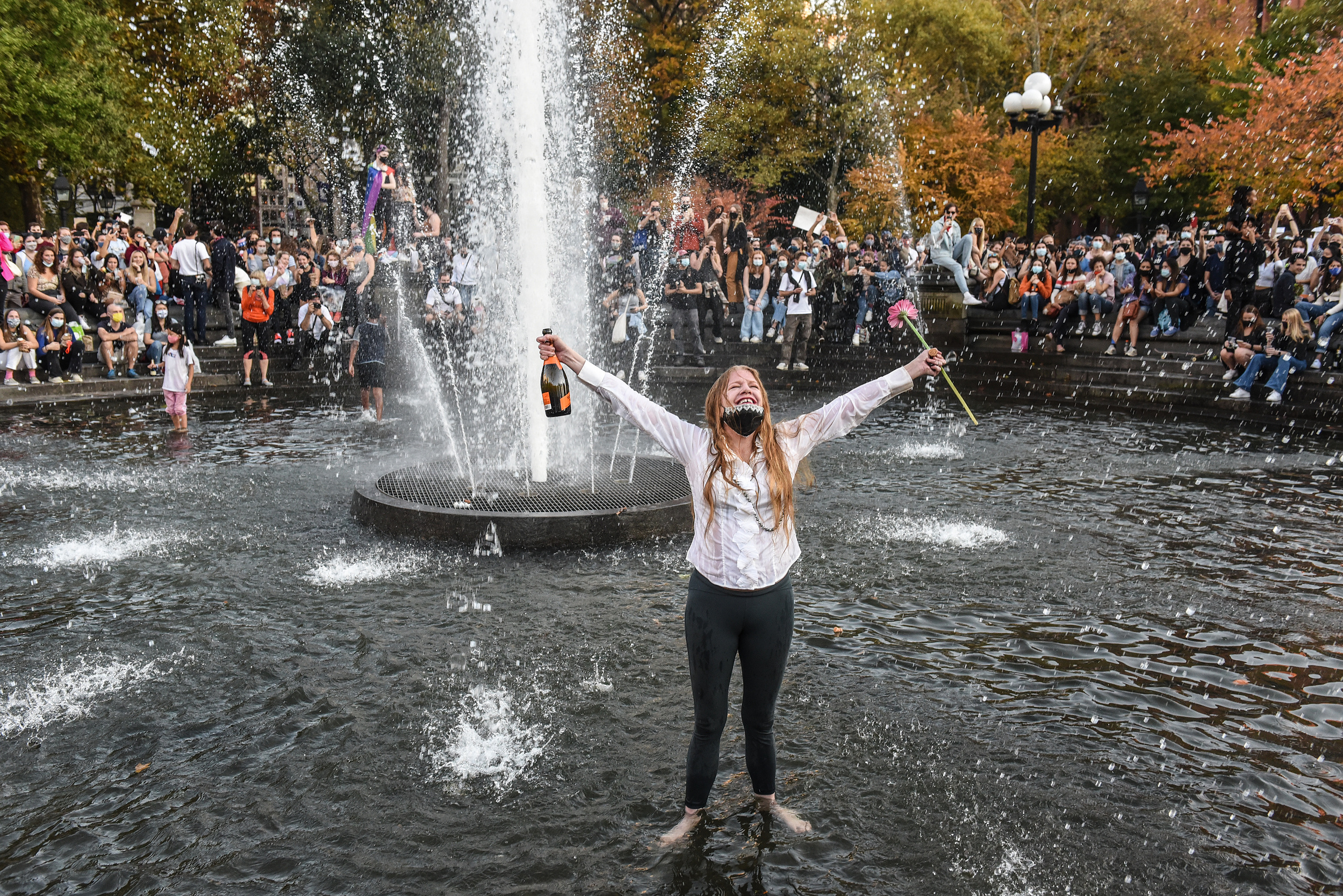 NEW YORK, NY - NOVEMBER 07: Supporters of Joe Biden celebrate on November 7, 2020 in Washington Square Park in New York, United States. According to several news outlets presidential candidate Joe Biden has defeated incumbent U.S. President Donald Trump t
